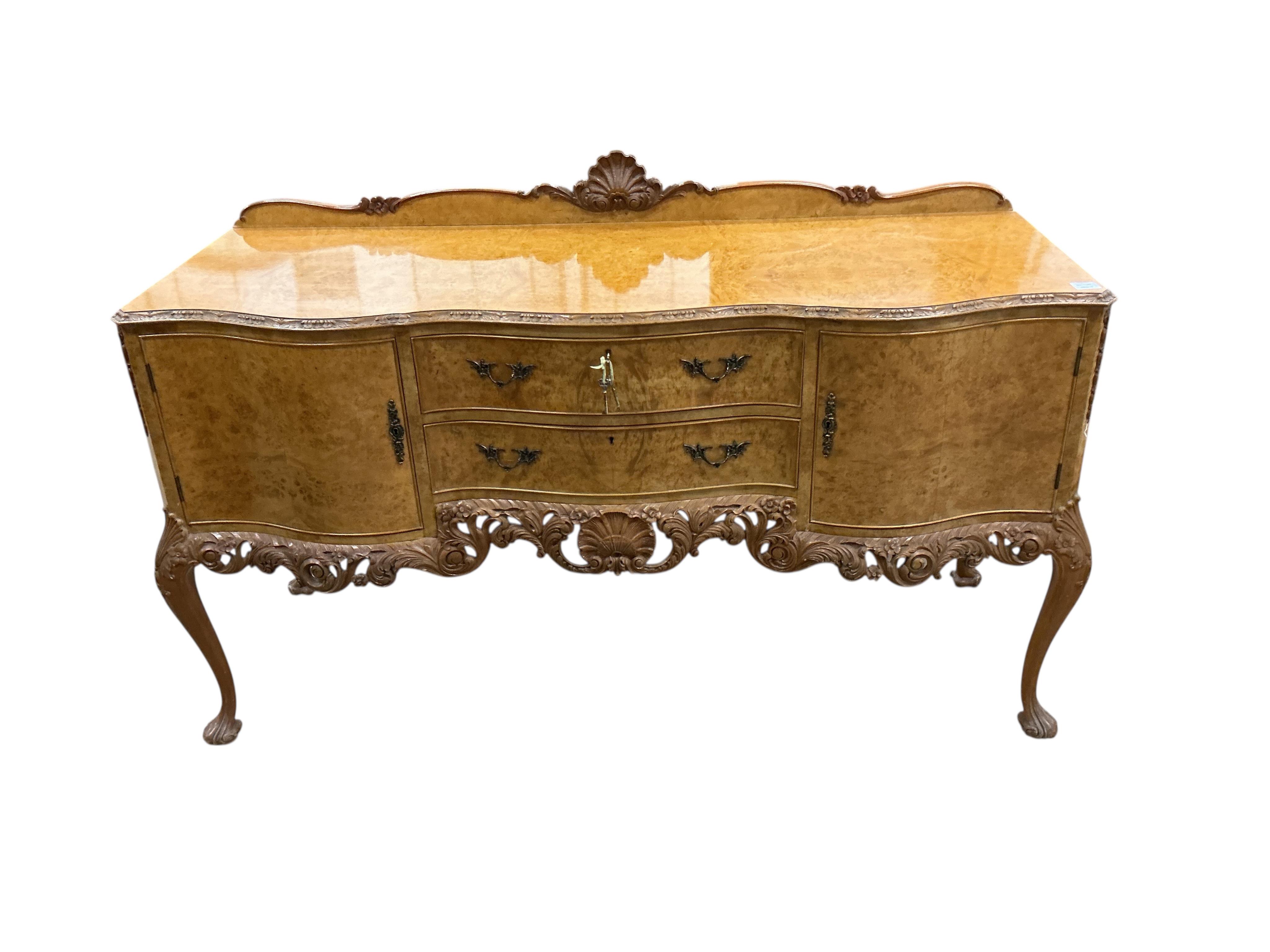 A Queen Anne Revival walnut serpentine sideboard, width 168cm, depth 60cm, height 91cm